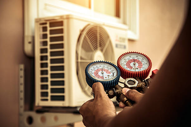 Professional Air Conditioning Service technician working in Patchogue, NY